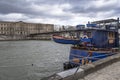 The Seine in Paris with the Louvre and a boat